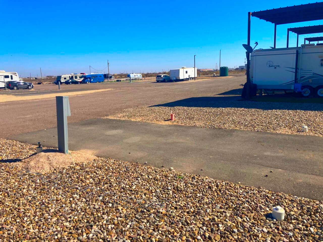 Wide asphalt-paved drives and RV spaces at RV Park of Odessa